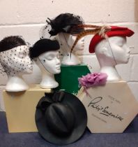 A quantity of 20th Century hats comprising a Philip Somerville black silk hat with net and bow