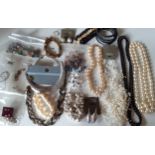A quantity of mainly modern costume jewellery and semi-precious loose stones to include bead