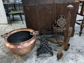 A copper twin ring handled planter, wall hanging flower basket, wrought iron fire dog, and one other