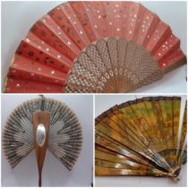 Three Continental fans to include a Victorian treen and paper cockade fan with inset mirror.