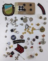 A mixed lot of mainly badges to include a Durham Light Infantry cap badge, and others, together with