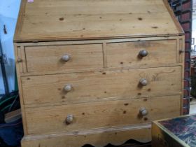 Victorian pine bureau, fall flap revealing a fitted interior of pigeon holes and drawers over two