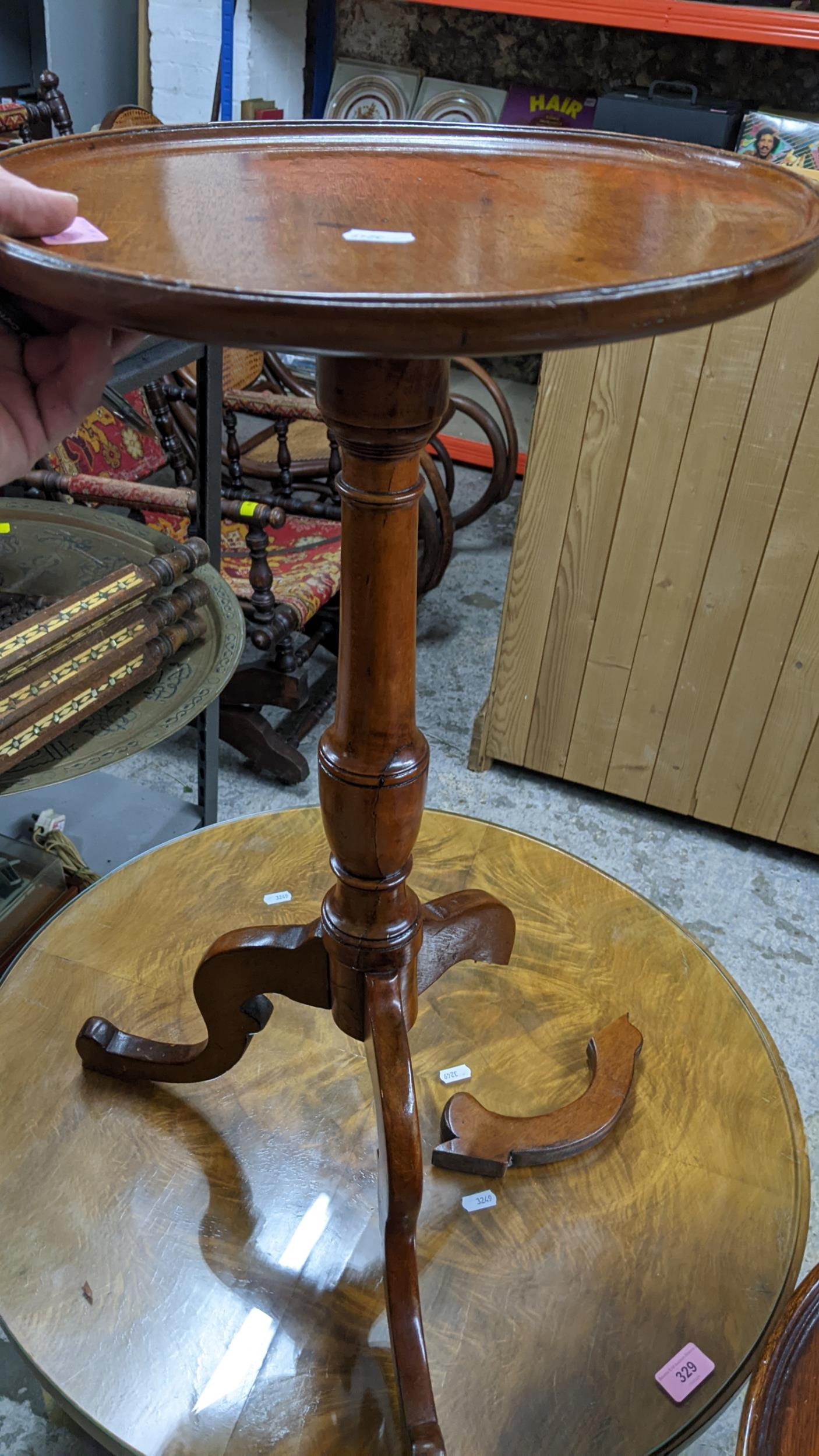 An Art Deco period walnut three tier circular table with quarter cut and glass top, supported on - Image 2 of 2