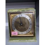 An Elliot onyx cased mantle clock, retailed by Jamieson and Carry with presentation plaque to top of