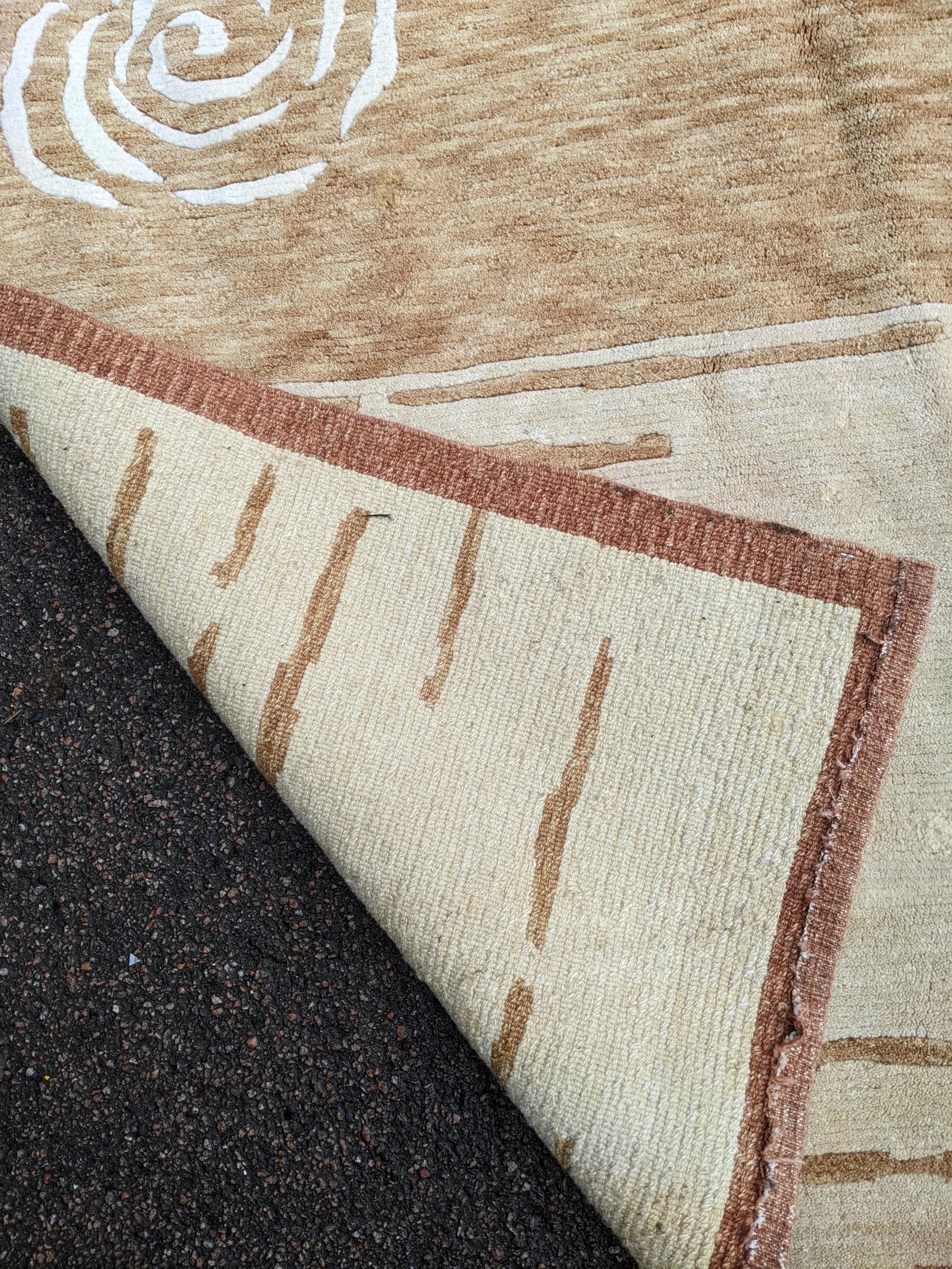 A contemporary cream and beige rug with swirl and line decoration 242cm x 175cm Location:A3B - Image 4 of 4