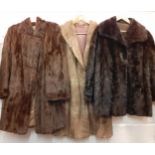 Three vintage fur coats and jackets to include a dark brown ermine coat 36" chest, a mid brown fur