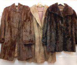 Three vintage fur coats and jackets to include a dark brown ermine coat 36" chest, a mid brown fur