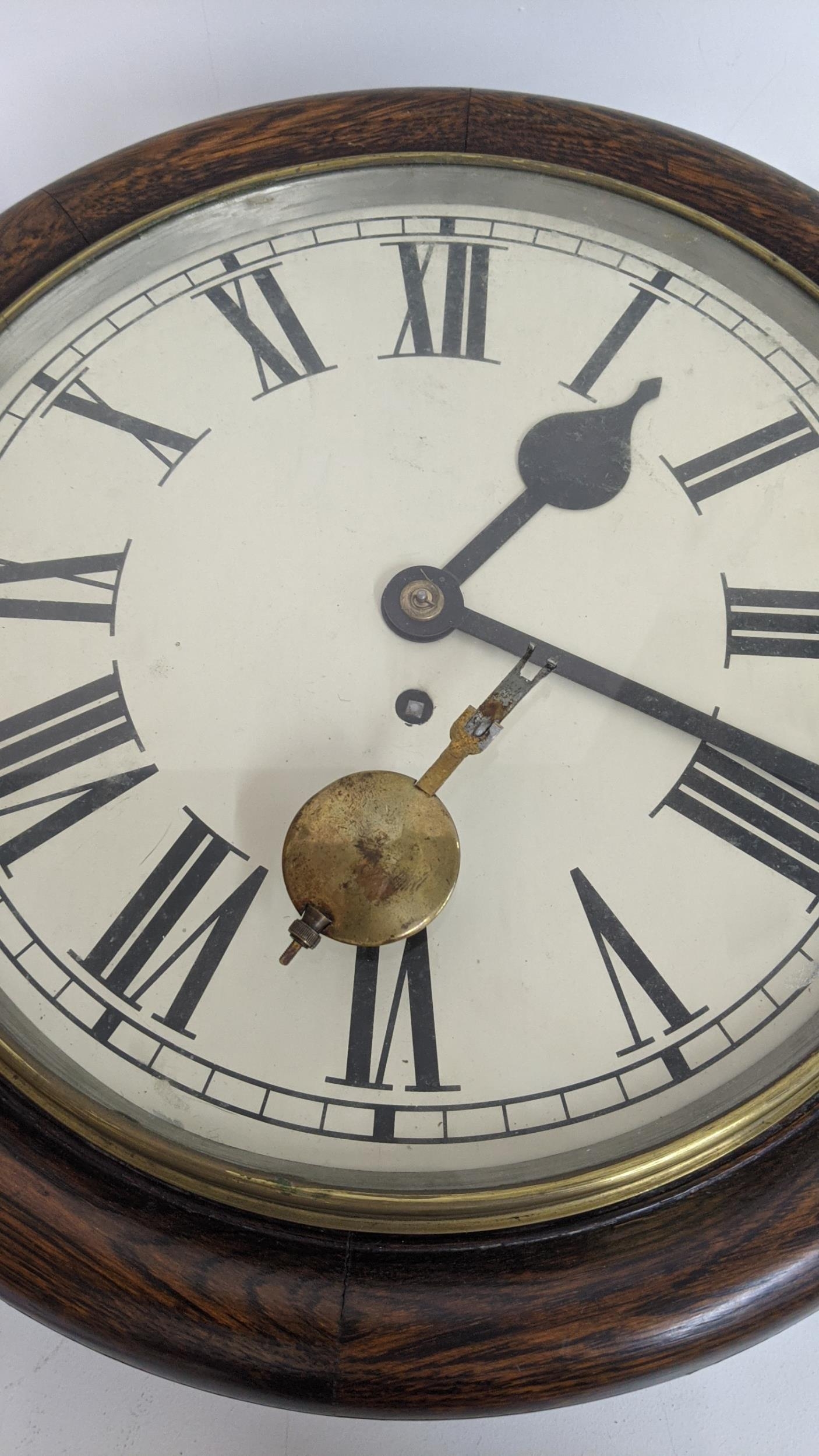 An early 20th century 12 inch dial clock with an 8-day fusee movement Location: - Image 2 of 2
