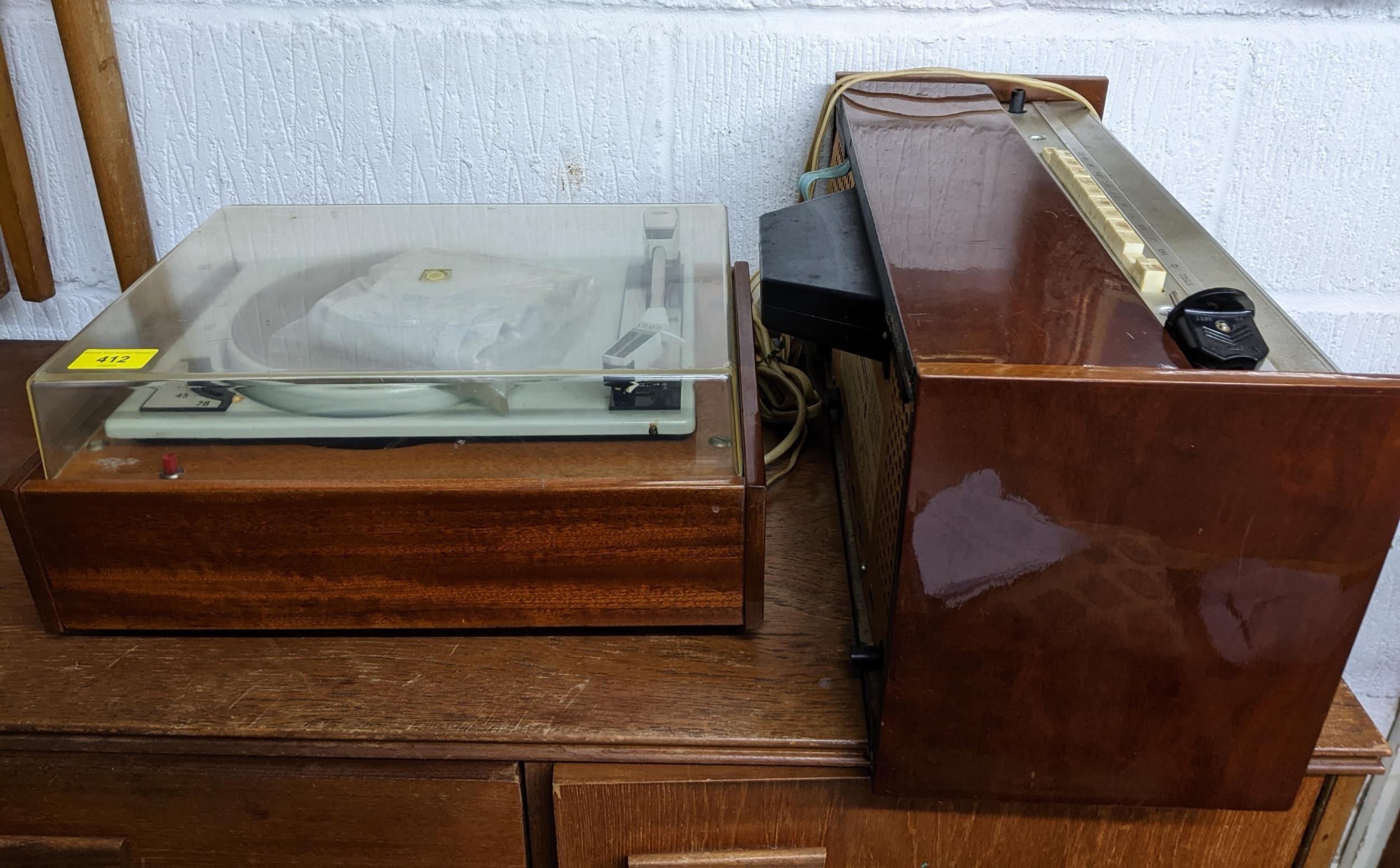 A mid-century teak cased stereo record deck, and a Rigonda Marksman stereo audio radio Location: