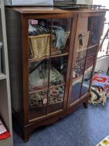 An early to mid mahogany bow fronted display cabinet, twin glazed doors on bracket feet 104x80x33cms