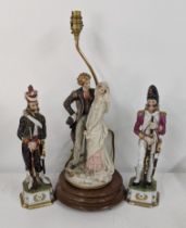 A pair of early porcelain French model soldiers and a Capodimonte lamp Location: