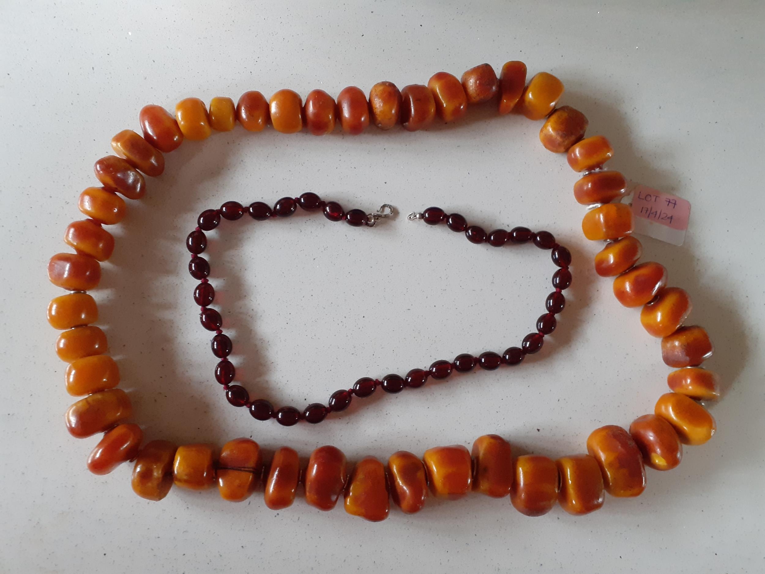 Two vintage resin necklaces in the amber style, the cherry amber style weighs 41.3g and the larger