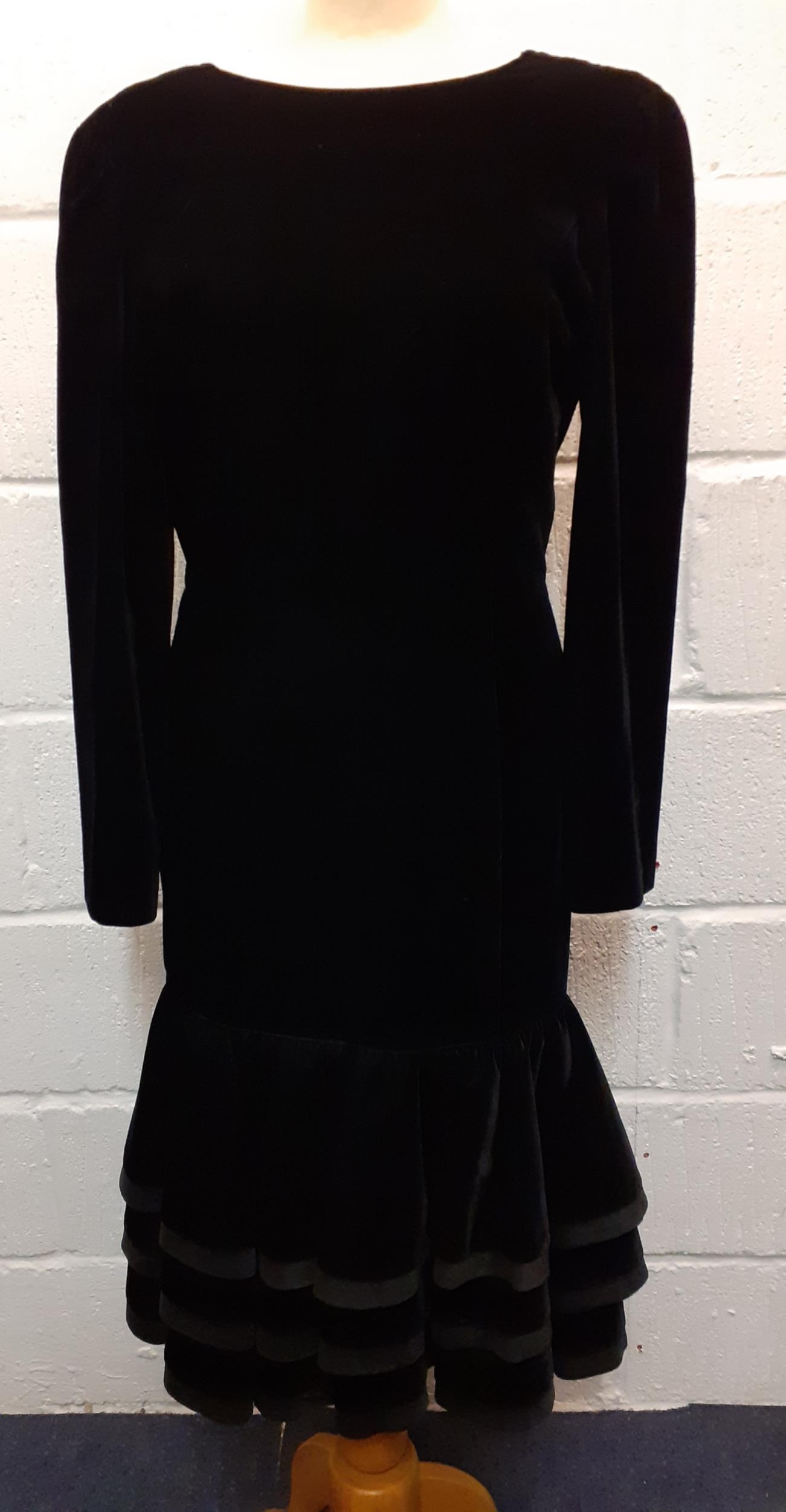 Louis Feraud-A 1980's black cocktail dress having a plunged back with bow detail and a 3 tiered