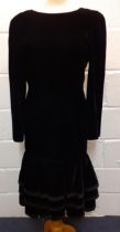 Louis Feraud-A 1980's black cocktail dress having a plunged back with bow detail and a 3 tiered