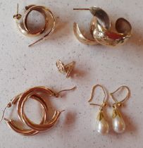 Five pairs of 9ct gold and yellow metal earrings to include a pair of 9ct gold and pearl drop