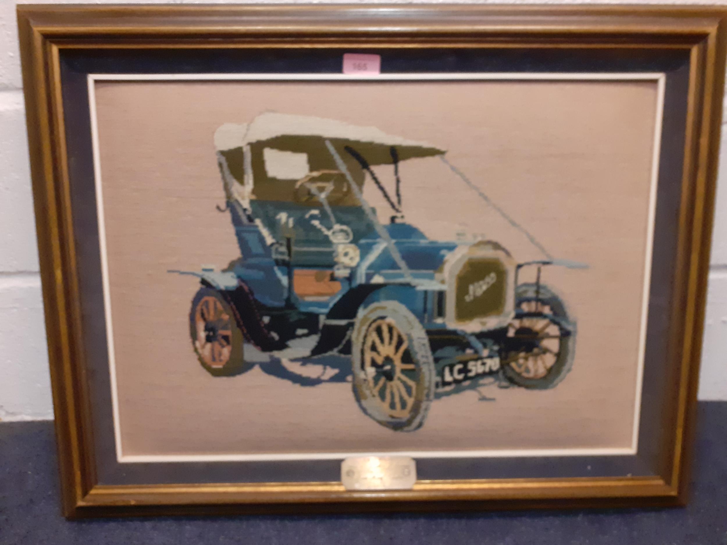 A framed 1979 woollen cross stitch picture of a 1905 Mass Motorcar owned by Lytton P. Farman, worked