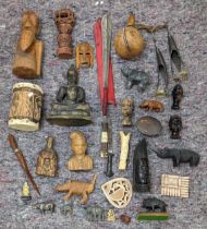 A collection of African style wooden sculptures and figures to include a seated Buddha, a drum and