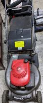 A Honda HRD 536 petrol lawn mower with grass box Location: