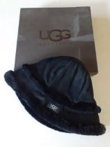 Ugg- A black 'City' bucket hat with black shearling lining, size small/medium with branded box.