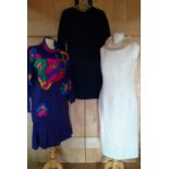 Three outfits comprising an Escada purple knit 2-piece with colourful mask design to the jumper