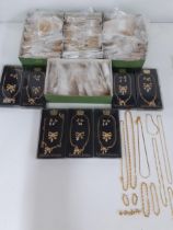 A large quantity of unopened gold tone modern chains and earrings together with 7 boxed Rancroft