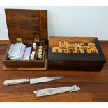 Two boxes, one containing poker dice, and a silver plated Gaucho knife Location: A2M