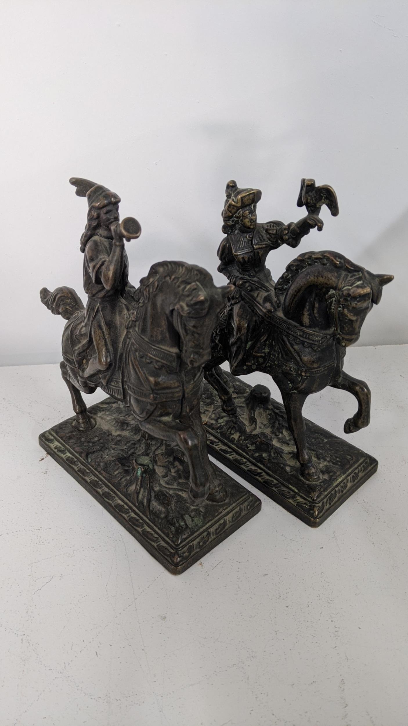 A pair of late 19th century bronze models of figures on horses, a cast model rabbit pin cushion - Image 3 of 3