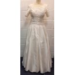 A Donerica off white silk effect wedding dress and vintage hats to include boaters, the dress having