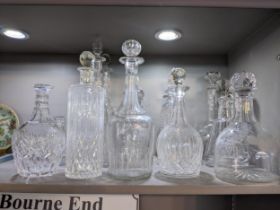 Fourteen decanters, some cut glass and crystal examples, some with stoppers Location: