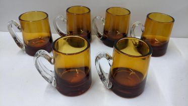 A set of six Whitefriars amber coloured glass mugs, 11cm h Location: