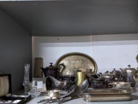 A mixed lot of silver plate to include a three-piece teaset, oval tray, and a pair of servers, and