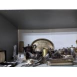 A mixed lot of silver plate to include a three-piece teaset, oval tray, and a pair of servers, and