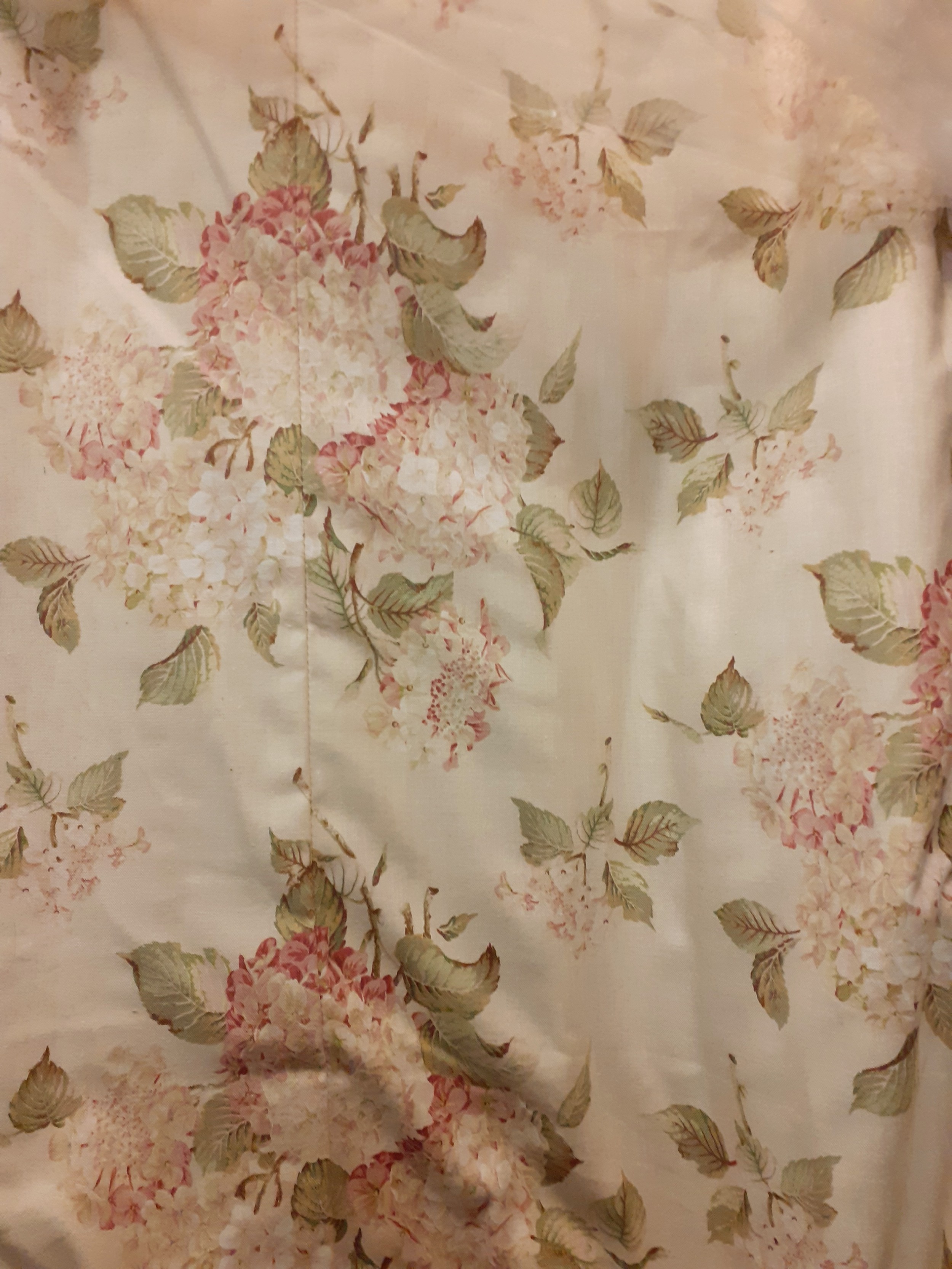 Two pairs of full length Fairfax & Cole curtains having a cream/light beige ground with hydrangea