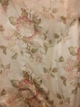 Two pairs of full length Fairfax & Cole curtains having a cream/light beige ground with hydrangea