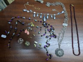 A selection of mainly costume jewellery to include a garnet beaded necklace, silver Celtic style