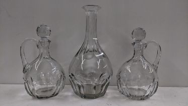 Three Baccarat glass decanters including one with a tall reeded neck 35.5cm h, and a pair with