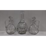 Three Baccarat glass decanters including one with a tall reeded neck 35.5cm h, and a pair with