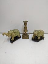 A pair of onyx model elephants A/F, and a 19th century brass candlestick Location: