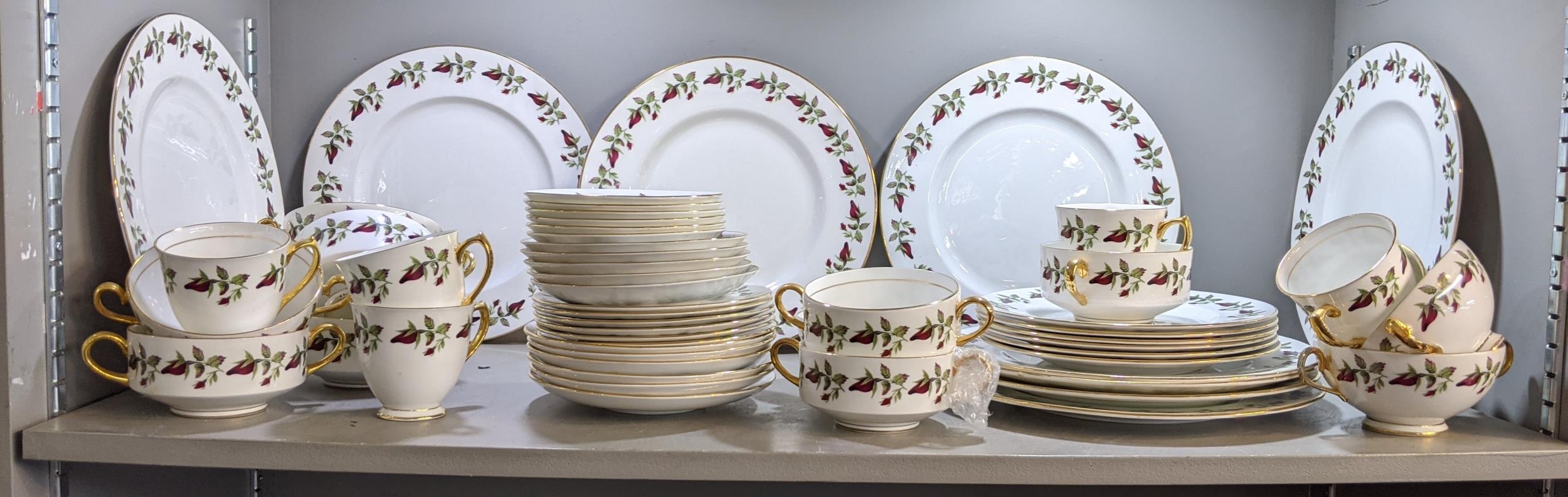 A Shelley 'Wild Roses' part dinner service comprising dinner plates, side plates cups and saucers,