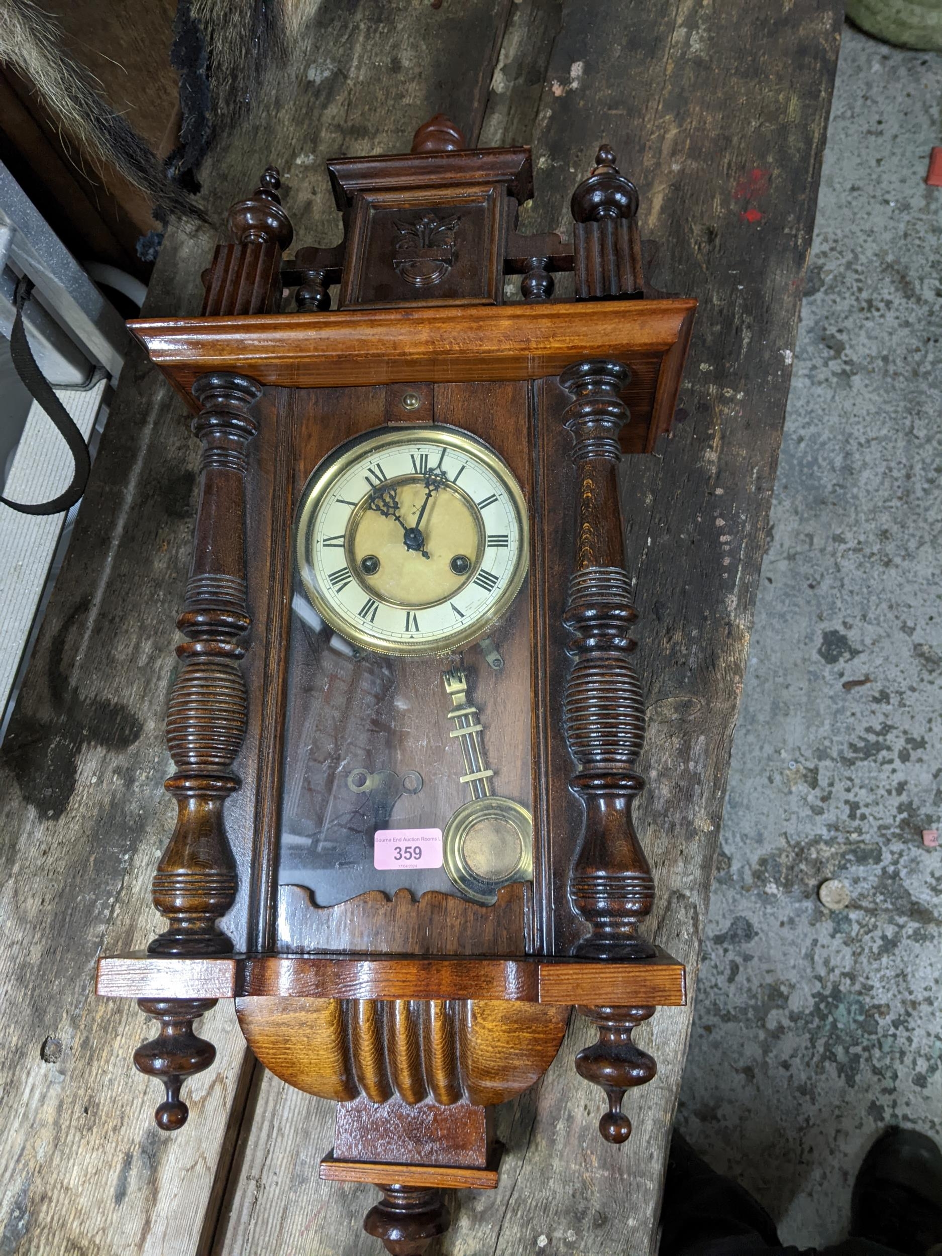A Hamburg American Clock Co Vienna regulator style wall clock with pendulum and key Location: