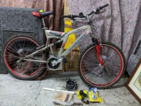 A Reflex dual suspension Trail Banger silver and red coloured bike, with bicycle pump, chain and