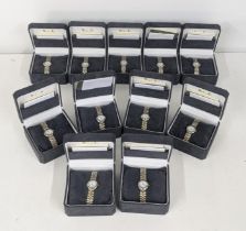 Eleven ladies Stainless steel Quartz wrist watches all having white faces and all one stainless