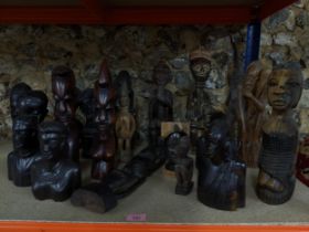 A group of African tribal art carved wooden figures and busts to include an Ashanti fertility figure