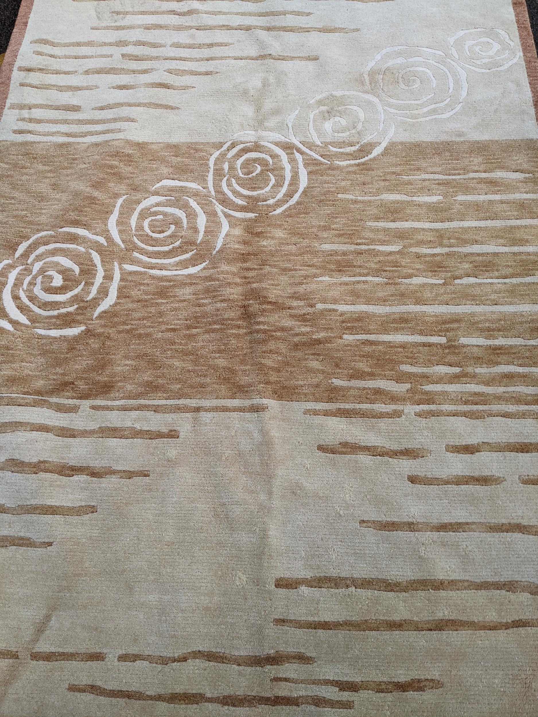 A contemporary cream and beige rug with swirl and line decoration 242cm x 175cm Location:A3B - Image 3 of 4