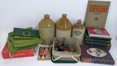 A mixed lot to include boxed Escalado stoneware flagons, corkscrews and various books Location: