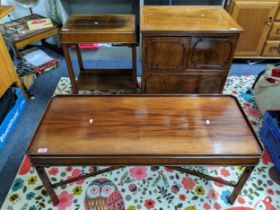 A Mahogany coffee table with galleried top, c-scroll corner brackets, pierced cross stretchers, a