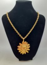 Chanel-A 1990's gold tone lion sun pendant having a double CC logo around the head, marks rubbed