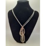 Chanel-A 1999 Autumn Collection silver tone necklace with white crystal detail having a double chain