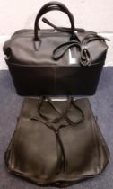 Two black M&S leather bags to include a weekend/cabin bag, new with an original tags (rrp £129).