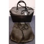 Two black M&S leather bags to include a weekend/cabin bag, new with an original tags (rrp £129).